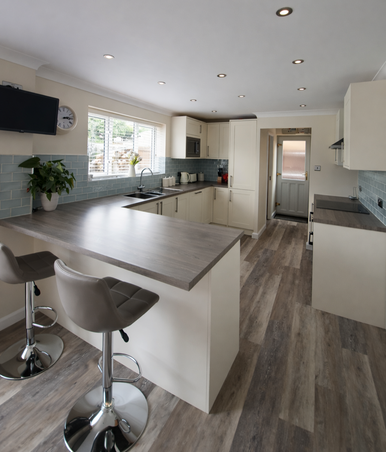 Fitted kitchen with breakfast bar installed by Beckinsale UK